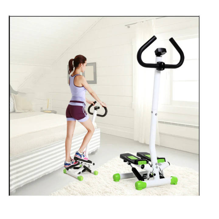 Woman using mini stepper with handlebar in bedroom – rear view